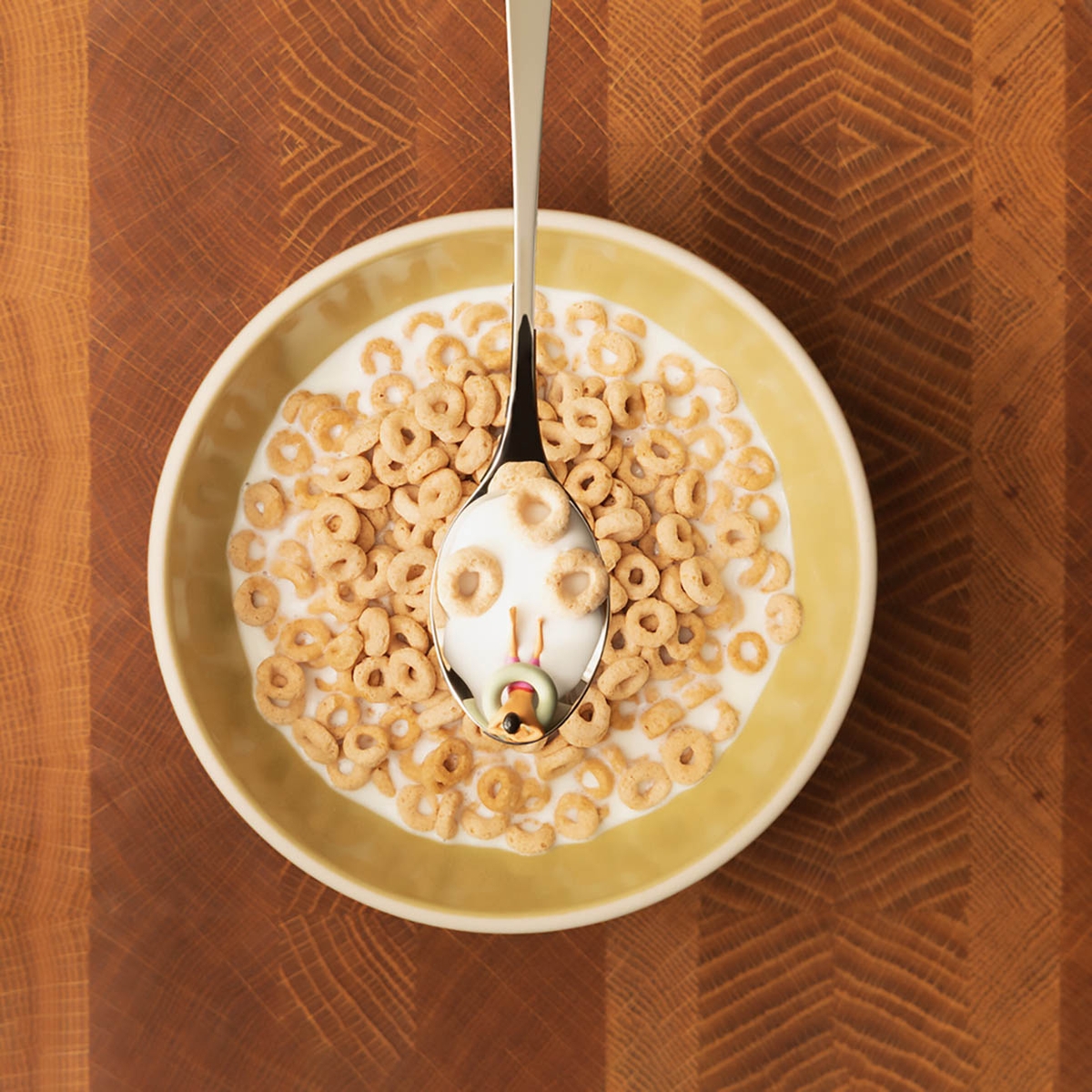 Christopher Boffoli, Cereal Spoon Swimmer, 2026, Archival pigment ink print on metallic paper, Available in various sizes