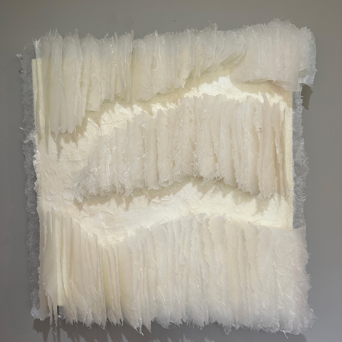 Kandis Susol: Embrace and Sustain, 2024, Artist made paper encaustic sculpture, 26 x 26 x 5 inches