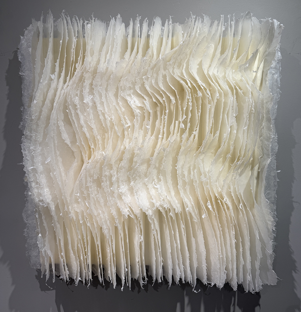 Kandis Susol, Embrace and Sustain, 2024, Artist made paper encaustic sculpture, 26 x 26 x 5 inches