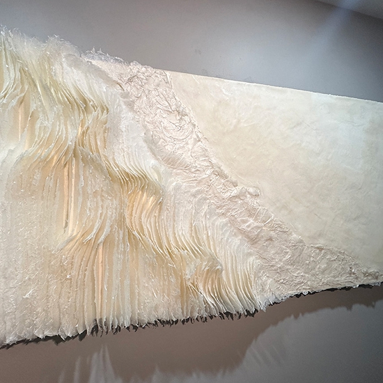 Kandis Susol, Radical Compassion, 2023, Artist made paper encaustic sculpture, 38 x 73 x 5 inches