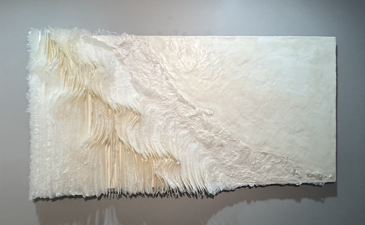 Kandis Susol, Radical Compassion, 2023, Artist made paper encaustic sculpture, 38 x 73 x 5 inches