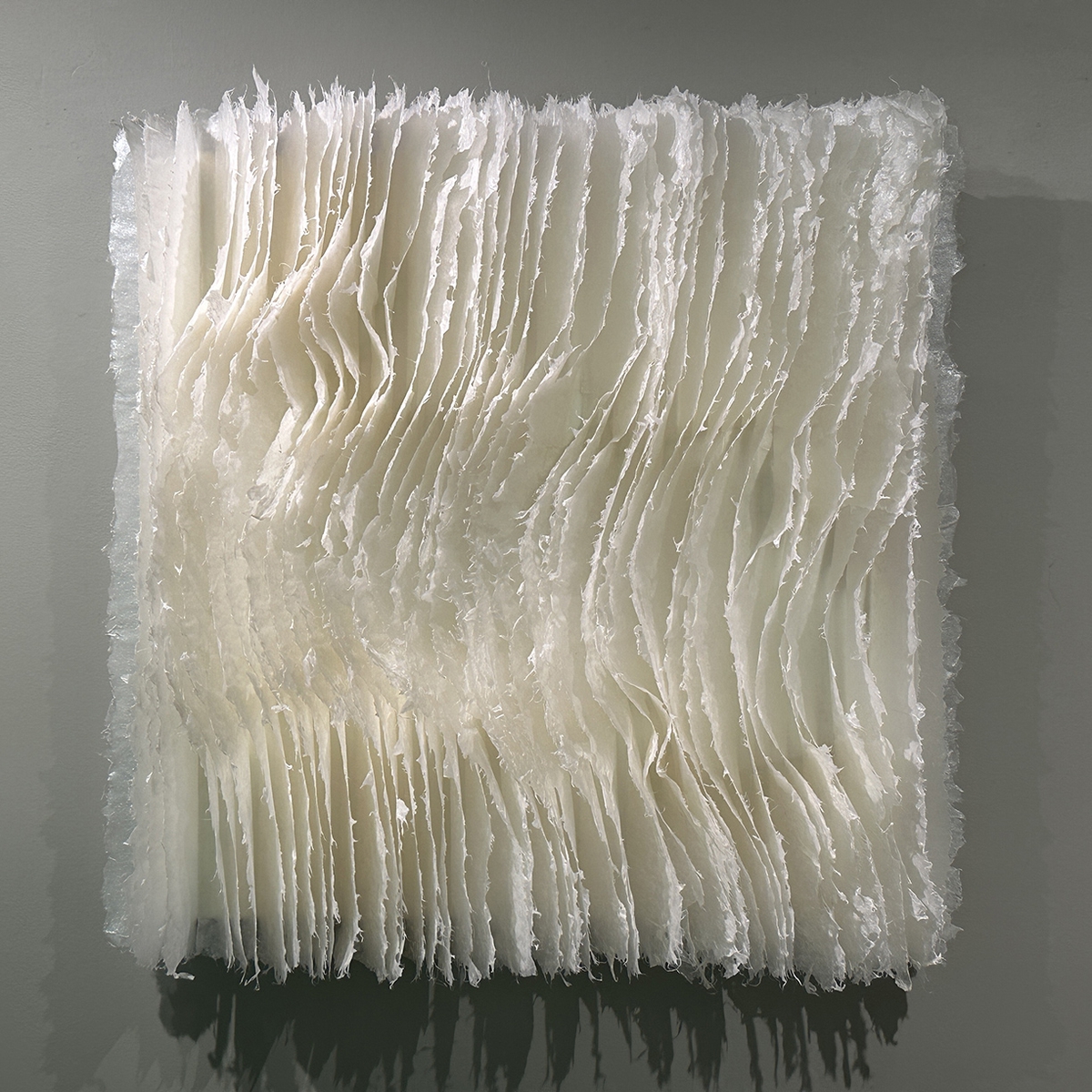 Kandis Susol, Shoreline Whispers, 2024, Encaustic sculpture, 26 x 26 x 5 inches