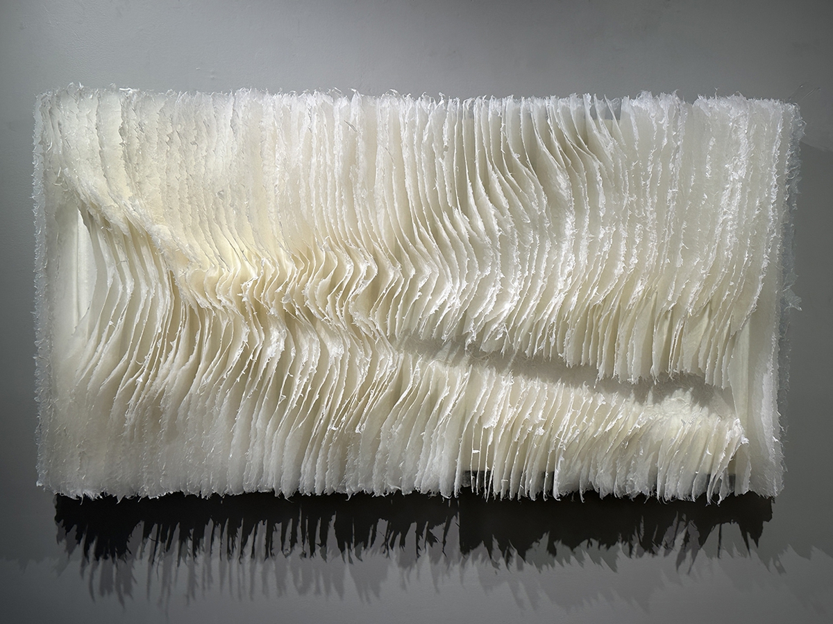 Kandis Susol, Valley Sounds Mountain Clouds 2, 2025, Encaustic sculpture, 26 x 50 x 5 inches